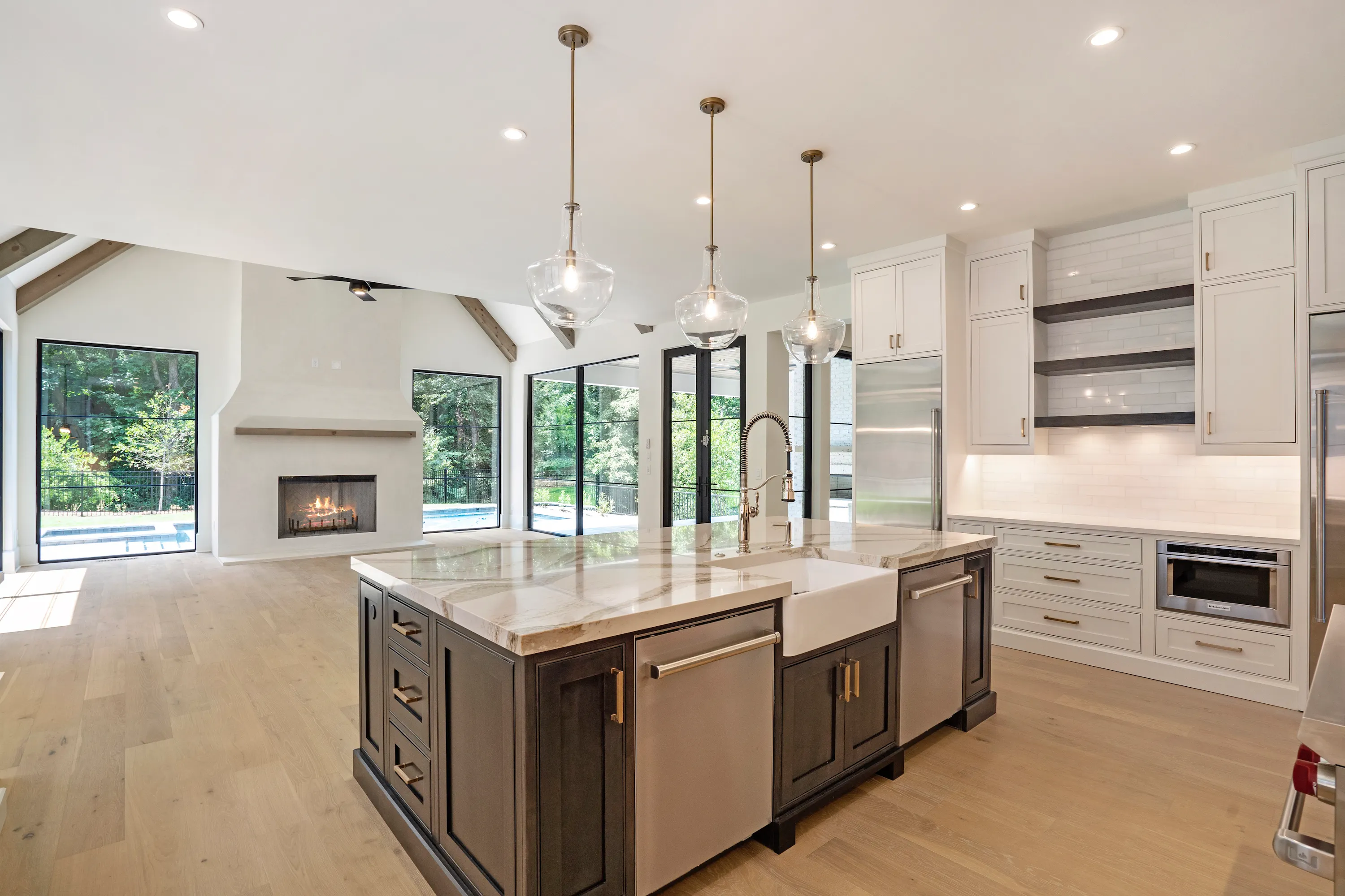 A custom OPREA kitchen with fitted cabinetry and stone countertops